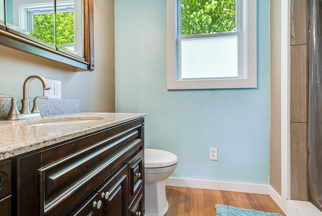 23 Paul St, South Berwick, ME 03908 - bathroom featuring toilet, vanity, wood finished floors, baseboards, and a shower