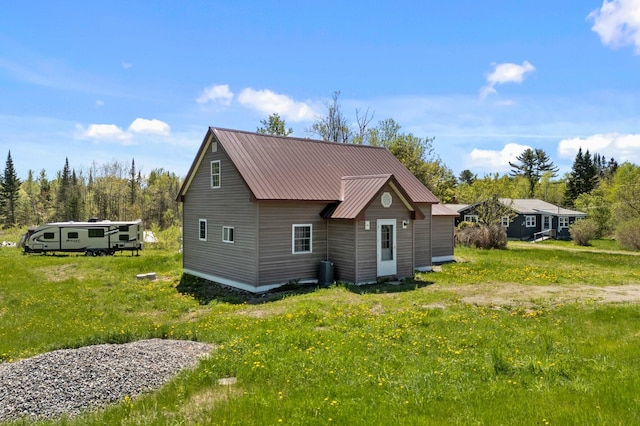 view of side of home featuring metal roof