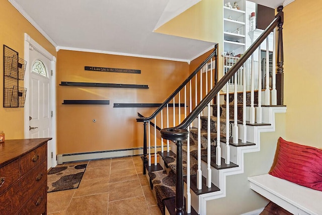 tiled entryway featuring ornamental molding, a baseboard heating unit, and stairway