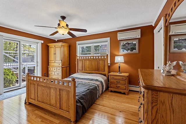 bedroom with a wall mounted AC, access to outside, light wood-type flooring, crown molding, and a textured ceiling