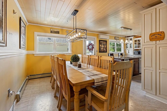 dining area featuring a wall unit AC, a chandelier, light tile patterned flooring, crown molding, and baseboard heating