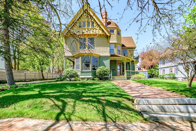 victorian-style house featuring a chimney