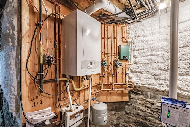 utility room featuring tankless water heater