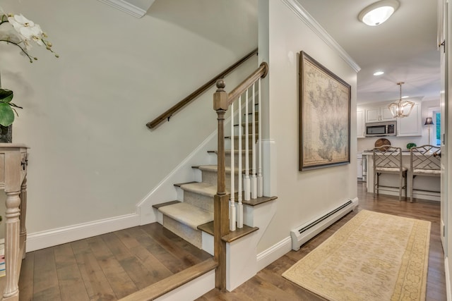 4 Brown Hill Ln, Scarborough, ME 04074 - stairway featuring a baseboard radiator, ornamental molding, a chandelier, wood finished floors, and baseboards