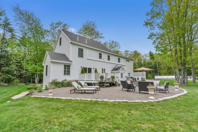 4 Brown Hill Ln, Scarborough, ME 04074 - rear view of house with a yard, a shingled roof, a patio area, and an outdoor hangout area