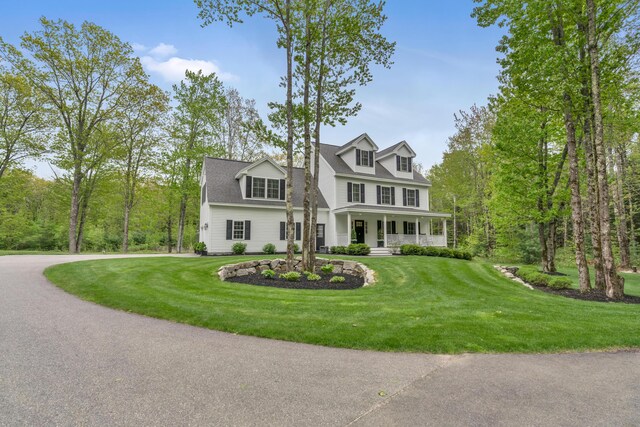 4 Brown Hill Ln, Scarborough, ME 04074 - view of front facade featuring covered porch and a front yard