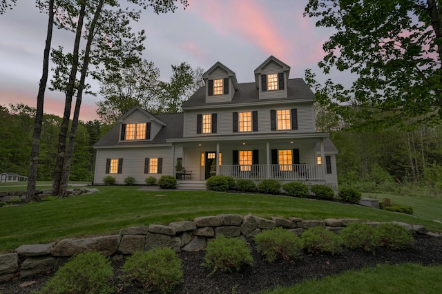 4 Brown Hill Ln, Scarborough, ME 04074 - view of front facade featuring a porch and a front yard