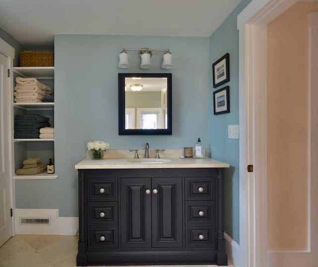 131 N St, Bath, ME 04530 - bathroom with vanity and baseboards