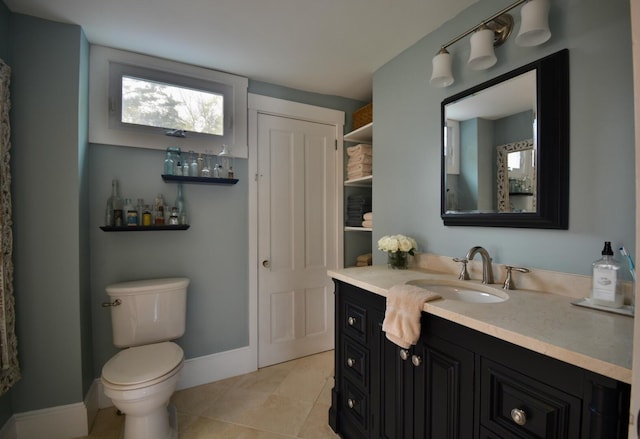 131 N St, Bath, ME 04530 - bathroom featuring vanity, tile patterned flooring, toilet, and baseboards