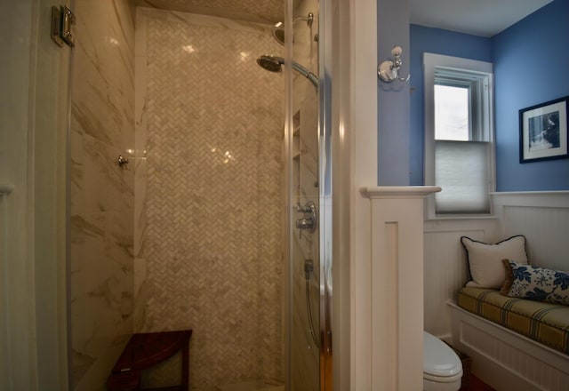 131 N St, Bath, ME 04530 - bathroom with toilet, a stall shower, and a wainscoted wall