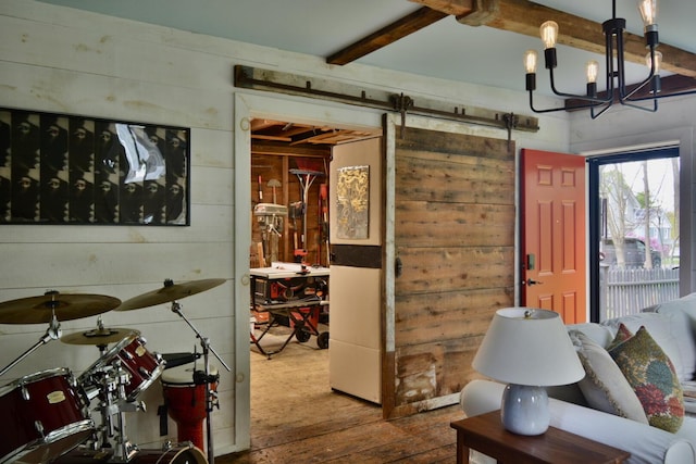 131 N St, Bath, ME 04530 - living area with a barn door, wood-type flooring, beamed ceiling, and a chandelier