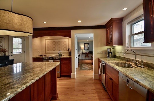 131 N St, Bath, ME 04530 - kitchen with appliances with stainless steel finishes, a sink, light wood-style flooring, plenty of natural light, and recessed lighting