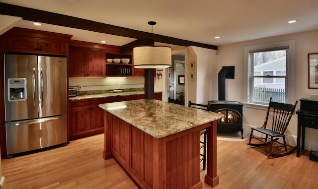 131 N St, Bath, ME 04530 - kitchen with stainless steel fridge with ice dispenser, light wood finished floors, tasteful backsplash, light stone counters, and recessed lighting