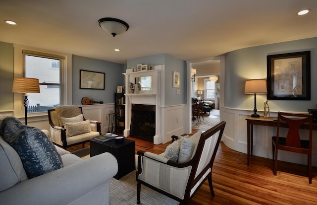 131 N St, Bath, ME 04530 - living room featuring wood finished floors, wainscoting, recessed lighting, and a fireplace