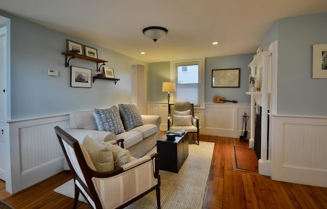 131 N St, Bath, ME 04530 - living area featuring wainscoting, wood finished floors, recessed lighting, and a fireplace