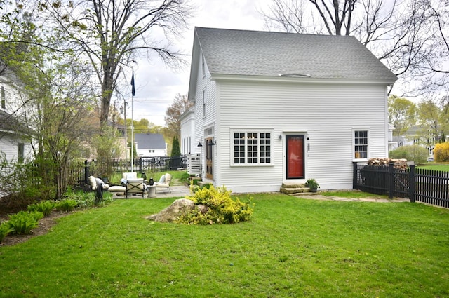 131 N St, Bath, ME 04530 - back of house with entry steps, roof with shingles, and a patio