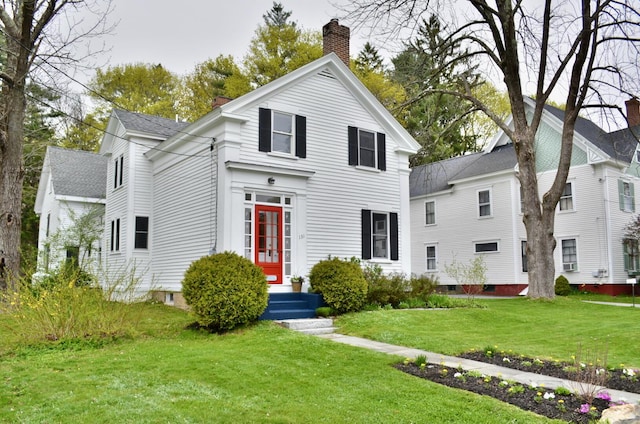 131 N St, Bath, ME 04530 - neoclassical / greek revival house featuring a chimney, a front lawn, a shingled roof, and entry steps