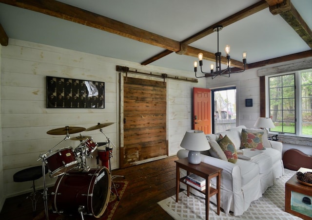 131 N St, Bath, ME 04530 - living area with wooden walls, hardwood / wood-style floors, beamed ceiling, a barn door, and a chandelier