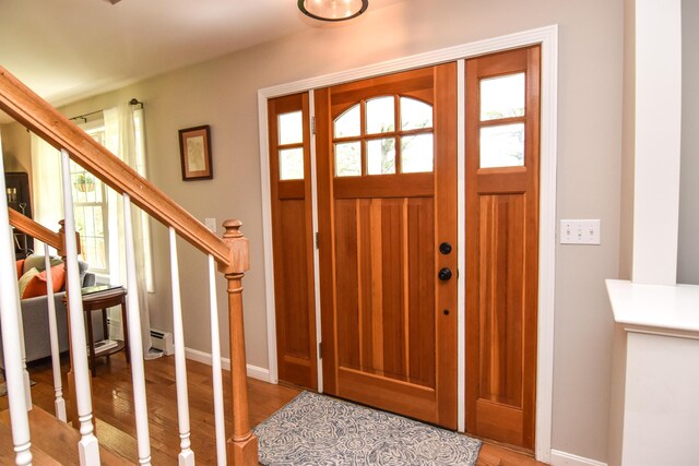 428 E Main St, Yarmouth, ME 04096 - entrance foyer with plenty of natural light, wood finished floors, stairway, and baseboards