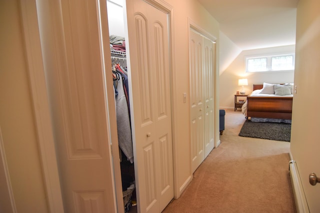 428 E Main St, Yarmouth, ME 04096 - hallway featuring light colored carpet, a baseboard radiator, and vaulted ceiling
