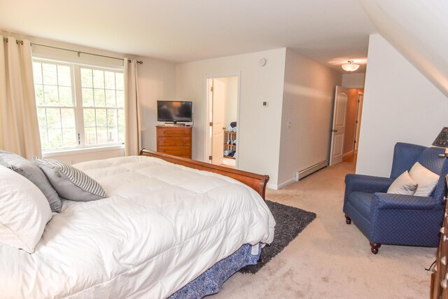 428 E Main St, Yarmouth, ME 04096 - bedroom with a baseboard radiator, light colored carpet, and baseboards