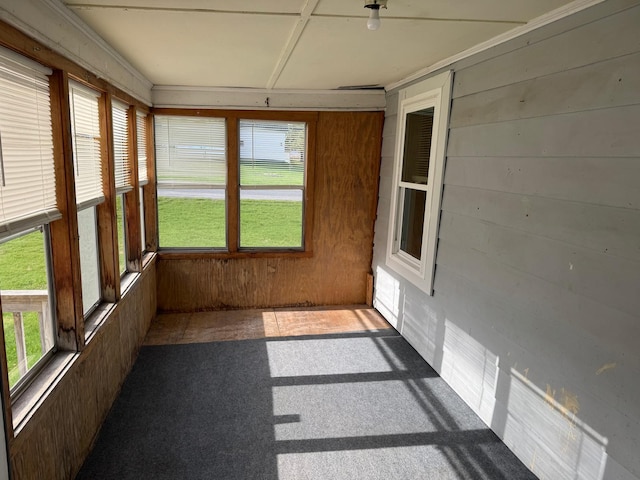 1575 Main St, Mapleton, ME 04757 - unfurnished sunroom with plenty of natural light, carpet floors, and wooden walls