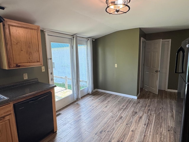 1575 Main St, Mapleton, ME 04757 - unfurnished dining area with lofted ceiling, wood finished floors, and baseboards