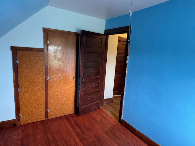 1575 Main St, Mapleton, ME 04757 - unfurnished bedroom with wood finished floors and lofted ceiling