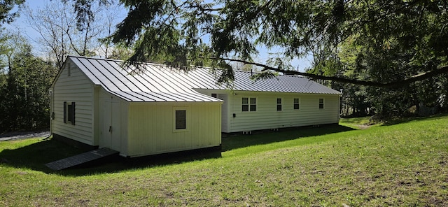 645 Kennebec St, Rumford, ME 04276 - back of property with a standing seam roof, a lawn, and metal roof