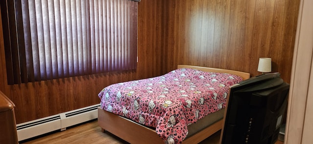 645 Kennebec St, Rumford, ME 04276 - bedroom featuring a baseboard radiator and wood finished floors