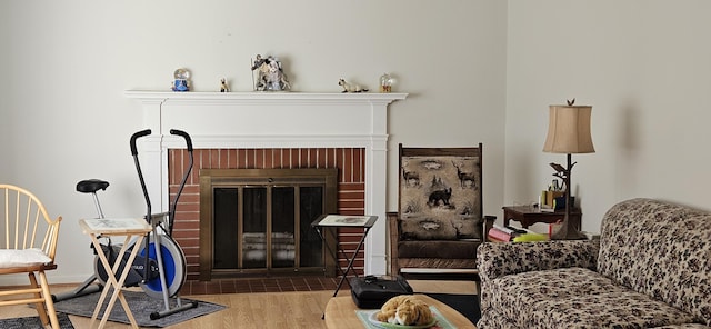 645 Kennebec St, Rumford, ME 04276 - living room with wood finished floors and a fireplace