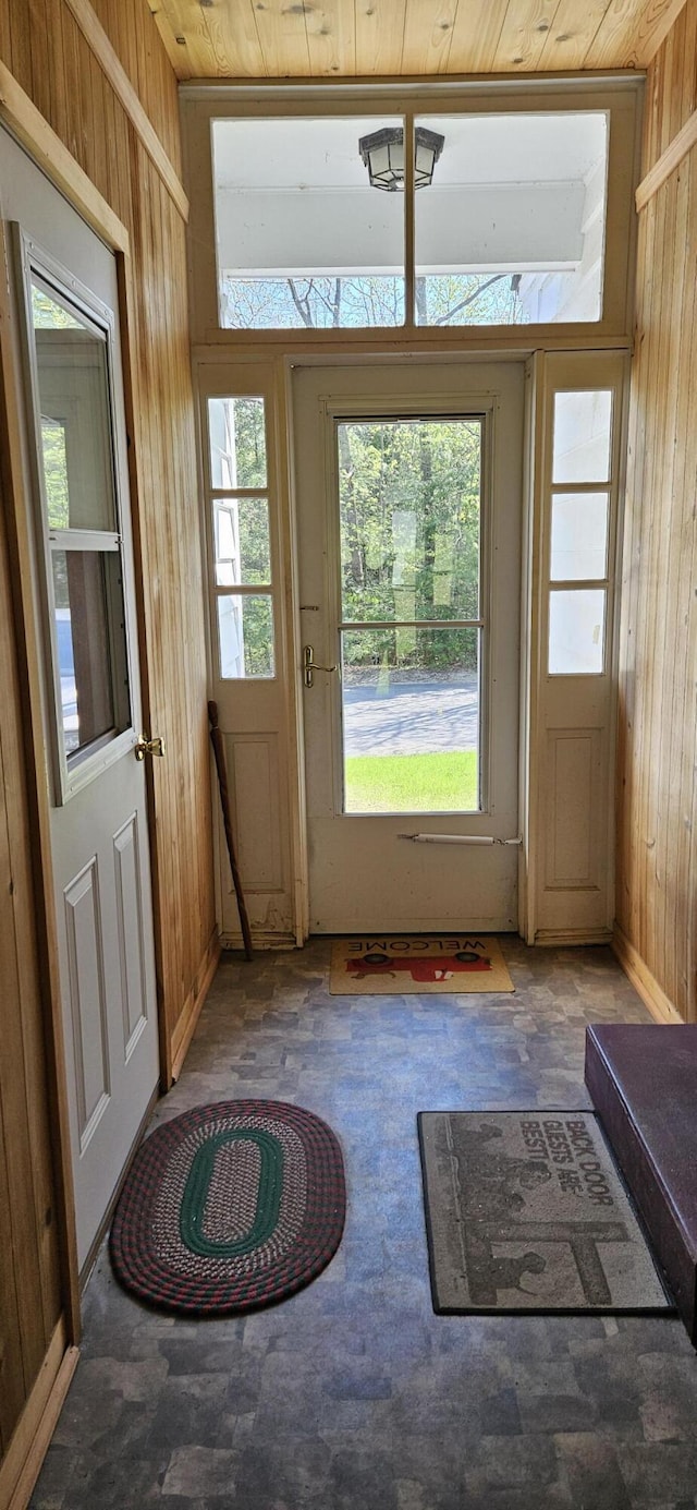 645 Kennebec St, Rumford, ME 04276 - doorway to outside featuring wood walls and plenty of natural light