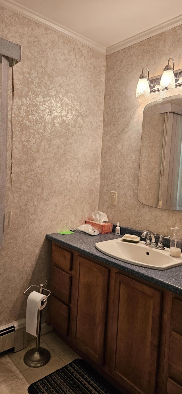645 Kennebec St, Rumford, ME 04276 - bathroom featuring crown molding, vanity, tile patterned floors, and a baseboard radiator