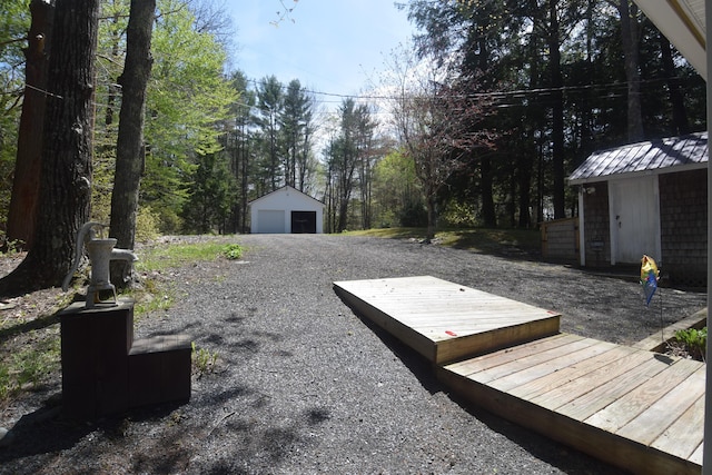 view of yard featuring an outbuilding and a garage