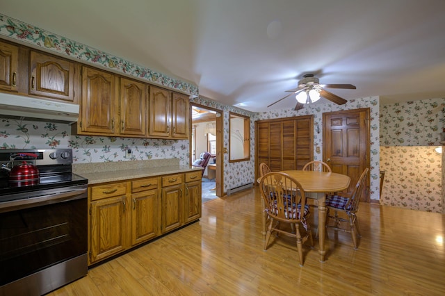 9 Ridge Rd, Westbrook, ME 04092 - kitchen featuring wallpapered walls, electric stove, under cabinet range hood, light wood-type flooring, and ceiling fan