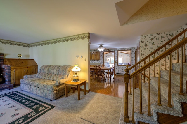 9 Ridge Rd, Westbrook, ME 04092 - living room with wallpapered walls, stairs, ceiling fan, carpet floors, and a wood stove