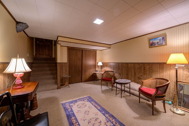 9 Ridge Rd, Westbrook, ME 04092 - living area with carpet flooring, a wainscoted wall, stairs, wood walls, and wallpapered walls