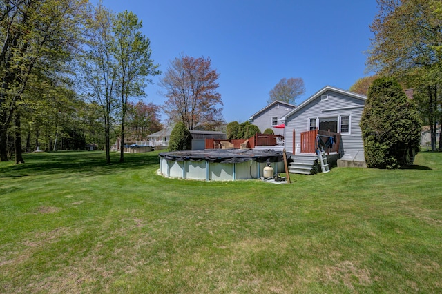 9 Ridge Rd, Westbrook, ME 04092 - view of green lawn with a covered pool and a wooden deck