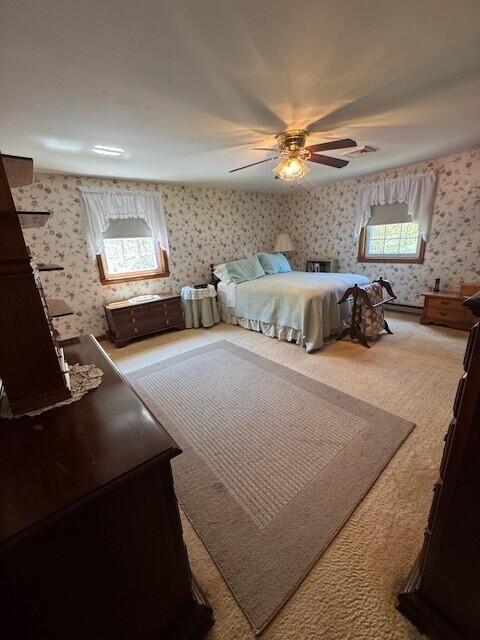 9 Ridge Rd, Westbrook, ME 04092 - bedroom featuring wallpapered walls, multiple windows, carpet floors, and a ceiling fan