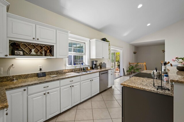 29 Gabriels Way, Turner, ME 04282 - kitchen with a sink, stainless steel dishwasher, vaulted ceiling, white cabinets, and light tile patterned flooring