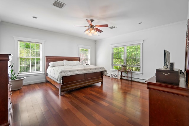 29 Gabriels Way, Turner, ME 04282 - bedroom featuring multiple windows, crown molding, dark wood-style flooring, a baseboard heating unit, and ceiling fan