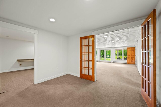 29 Gabriels Way, Turner, ME 04282 - empty room with carpet floors, french doors, baseboards, recessed lighting, and a baseboard radiator