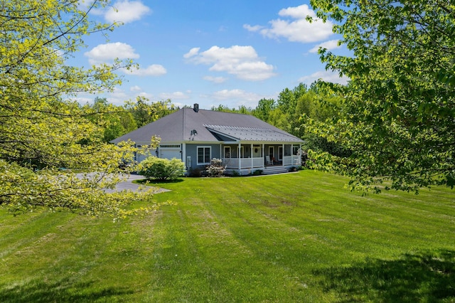 29 Gabriels Way, Turner, ME 04282 - rear view of house with a lawn, an attached garage, and a sunroom