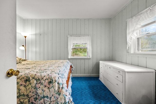 16 Columbia Ave, Tremont, ME 04612 - bedroom with carpet floors, multiple windows, and wooden walls