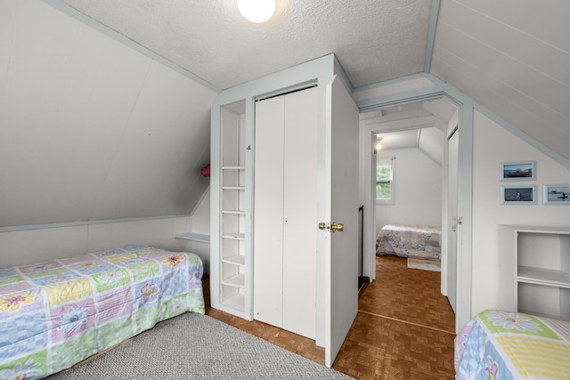 16 Columbia Ave, Tremont, ME 04612 - bedroom featuring lofted ceiling, a textured ceiling, and a closet