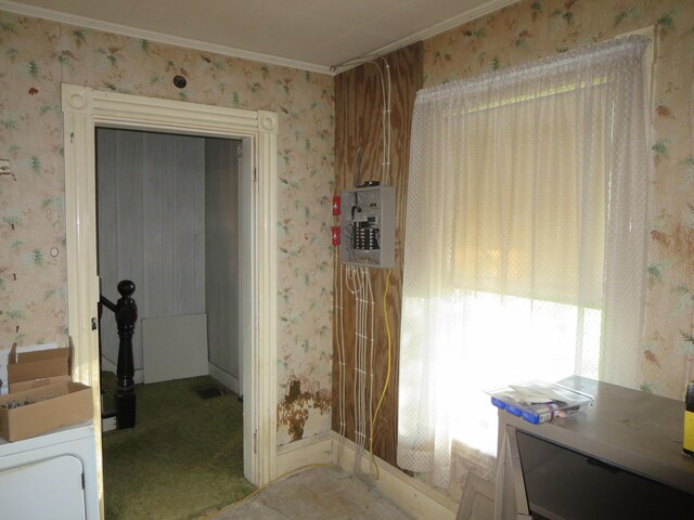 bathroom with wallpapered walls and ornamental molding