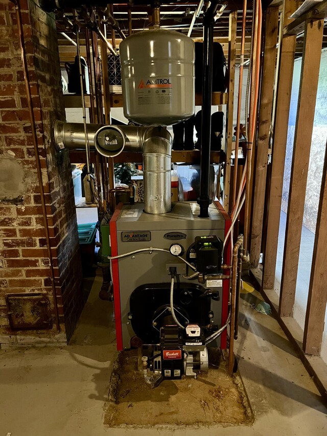 5 Mayo St, Caribou, ME 04736 - utility room featuring a heating unit
