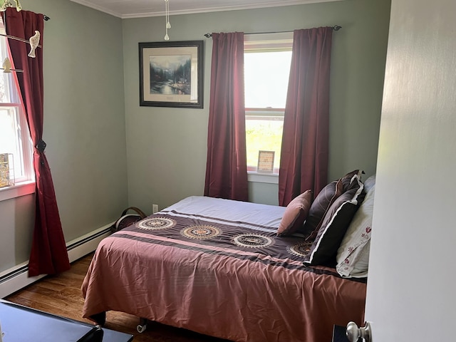 5 Mayo St, Caribou, ME 04736 - bedroom with wood finished floors, ornamental molding, and a baseboard heating unit