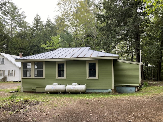 39 Salmon Rd, Madison, ME 04950 - view of side of property featuring a standing seam roof, metal roof, and crawl space