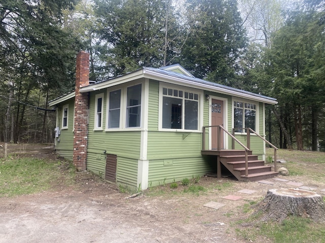 39 Salmon Rd, Madison, ME 04950 - view of front of house with a chimney